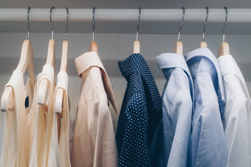 Apartment closet with hanging shirts